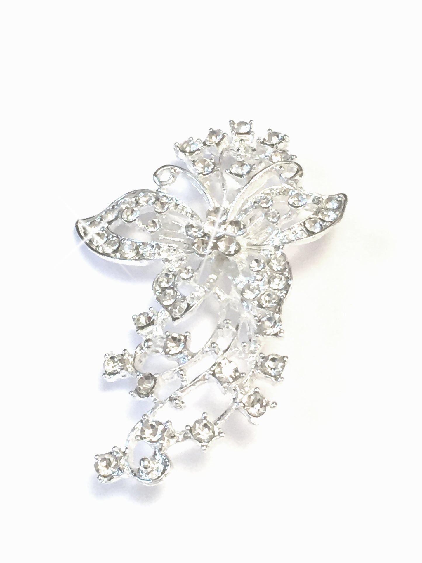 Sparkling Butterfly Brooch, This beautiful brooch is intricately designed with sparkling crystals, embracing a silver toned metal vine with a beautiful distinguished butterfly, with a pin & catch fastening