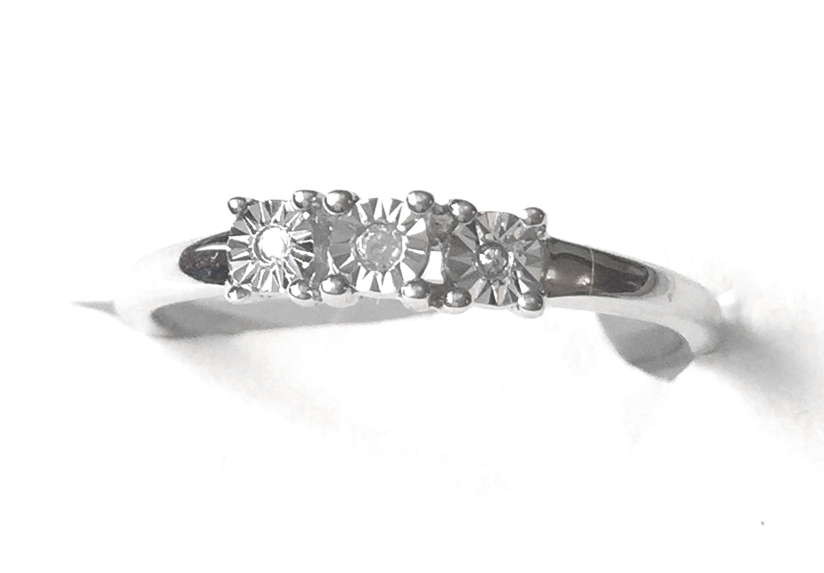 Diamond Halo Trilogy Silver Ring, An elegantly designed ring comprised of 0.030 carats of authentic diamond in a round cut and a trilogy design, set on a pure sterling silver ring