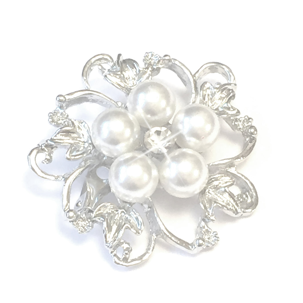Pearl Flower Brooch, A quaint and sophisiticated brooch in an exquisite flower design, with silver toned metal petals and leaves that surround five round white faux pearls, with one sparkling crystal set in the centre