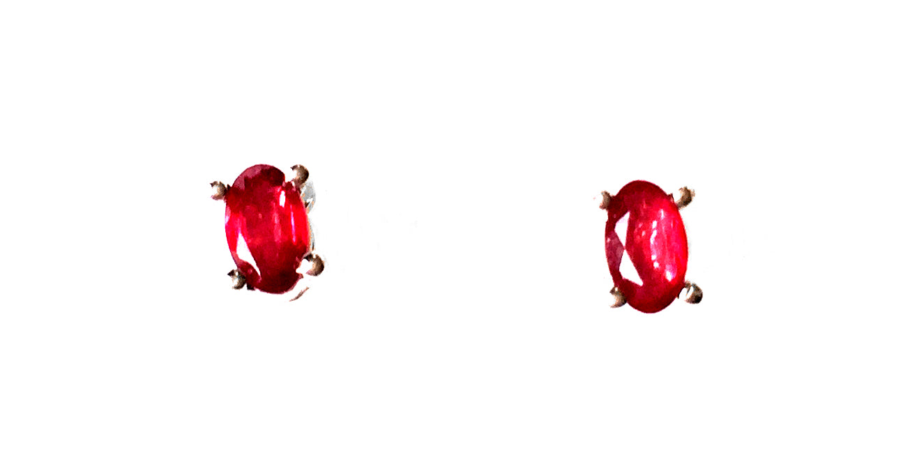 'Regal' Red Ruby Earrings, These beautifully designed earrings are quaint, capitvating and ornate. Created with 0.710 carats of authentic ruby in an oval shape, set in pure sterling silver stud earrings