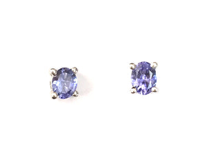 Tanzanite Sterling Silver Stud Earrings, An alluring and delightful pair of stud earrings created with 0.680 carats of tantalising Tanzanite of grade AA quality, in an oval design, set upon solid sterling silver earrings